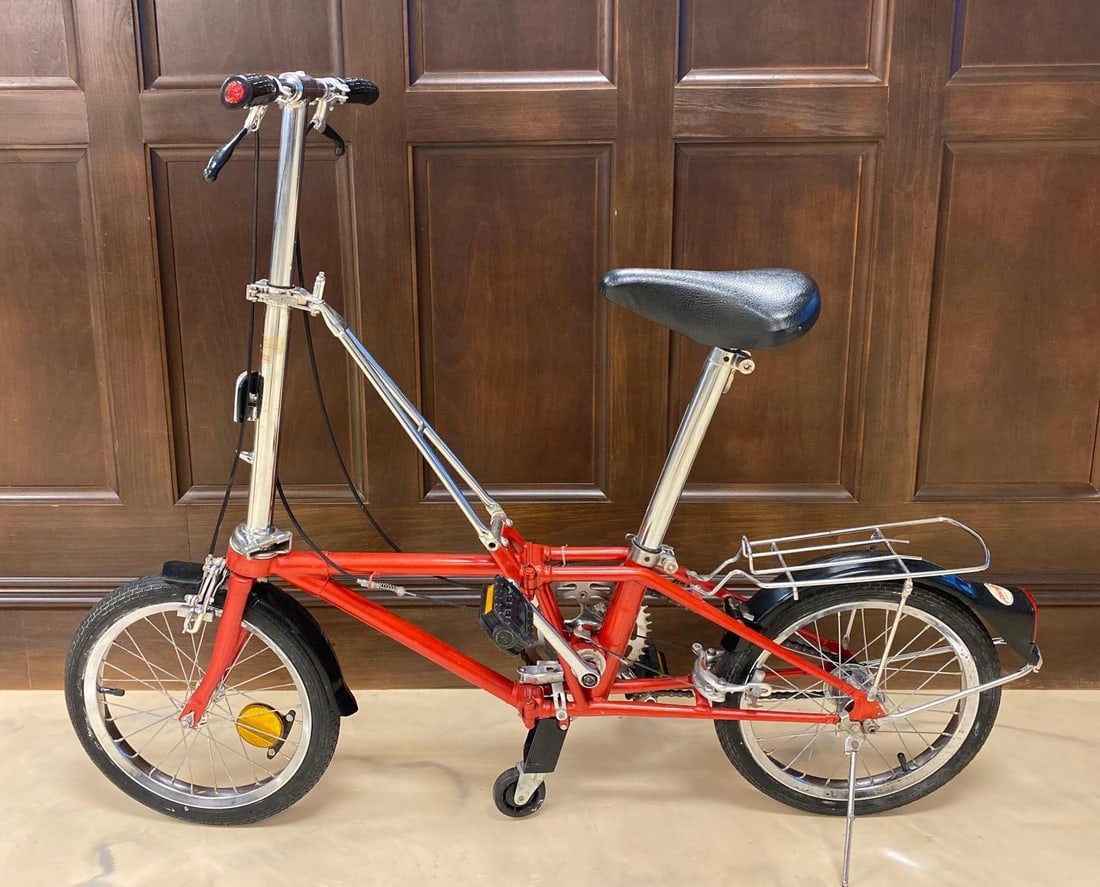 Circa 1980s Red Dohan Folding Bike: NO SHIPPING AVAILABLE. scratches throughout, measures 35 1/2 x 51 x 18 inches