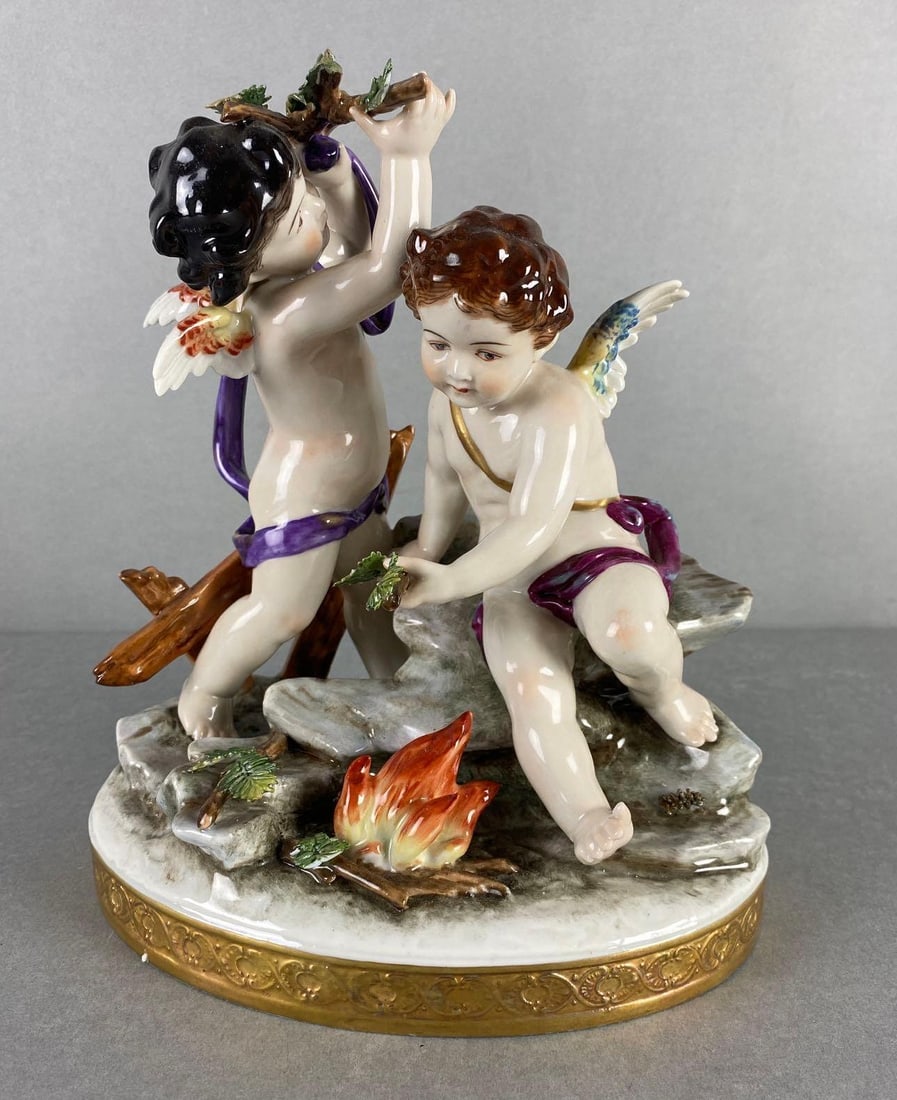 1937 Meissen Porcelain Cherubs: Broken leaf, makers mark on bottom, 8 1/4 x 7 x 5 1/2 inches