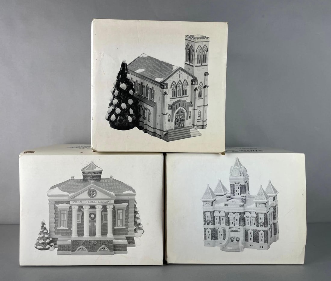 Group of 3 Department 56 Snow Village Buildings: Like new in original packaging. Includes cathedral, county courthouse, and village public library. Largest box measures 11 1/4 x 11 3/4 x 11 1/4 inches