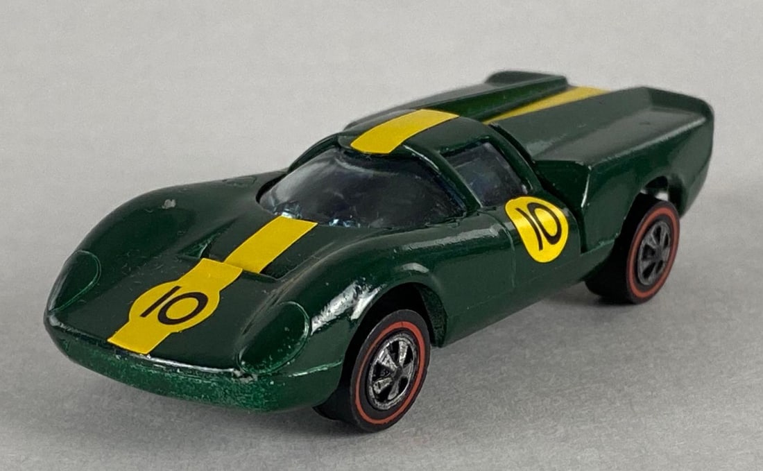 Hot Wheels Redline Lola GT70 Die-Cast Car: 1968, Mattel, Die-Cast, Red Line Tires, Green Body with Yellow Stripe.