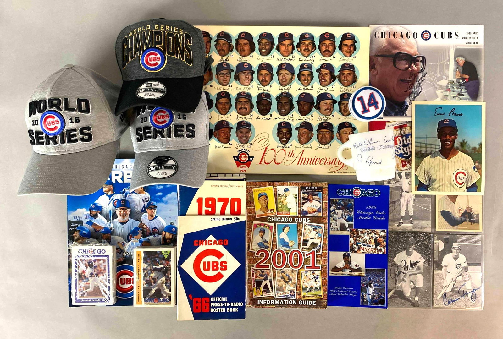 Collection of Chicago Cubs Memorabilia with HOF Autographs: Ron Santo 8 x 10 Autograph, Whitey Lockman, Jim Hickman, and more Autographs, Roster Book, Yearbooks, 1969 Chicago Cubs coffee cup, David Berg Team Sets, 3 World Series Hats, and more.?We guarantee th