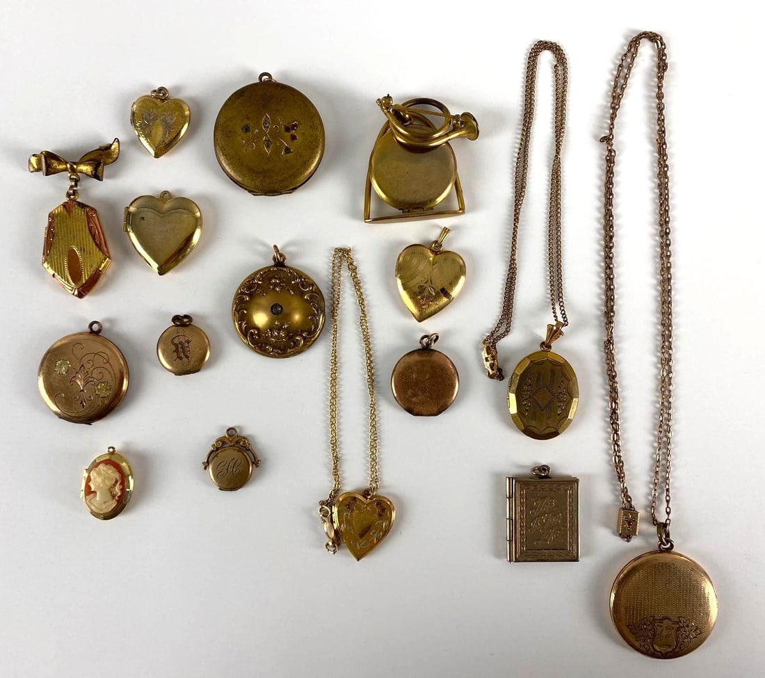 Group of 16 Vintage Lockets and More: Some on necklace chains, Largest locket measures 1 1/2 x 1 1/2 inches.