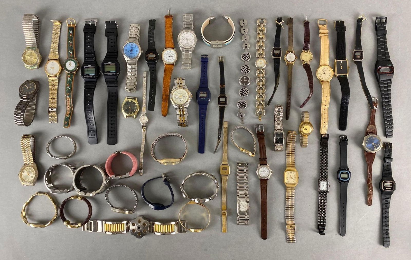 Group of 50+ Wristwatches: Unknown working condition, Includes Fossil, Helbros, Westclox, and more.