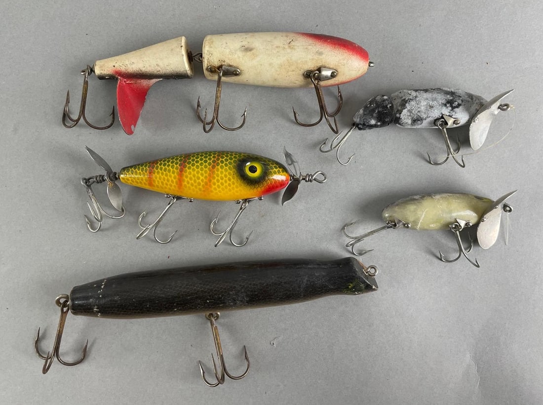Group of 5 Fishing Lures: Includes south bend lure, jointed bait, Fred arboga jitterbugs, and more. Largest measures 7 inches