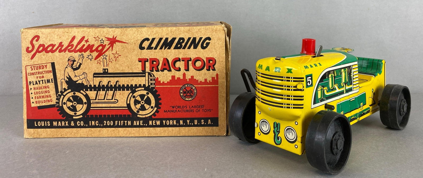 Sparkling Wind-Up Tin Litho Climbing Tractor: Unknown working condition, box measures 4 3/4 x 8 1/2 x 4 3/4 inches