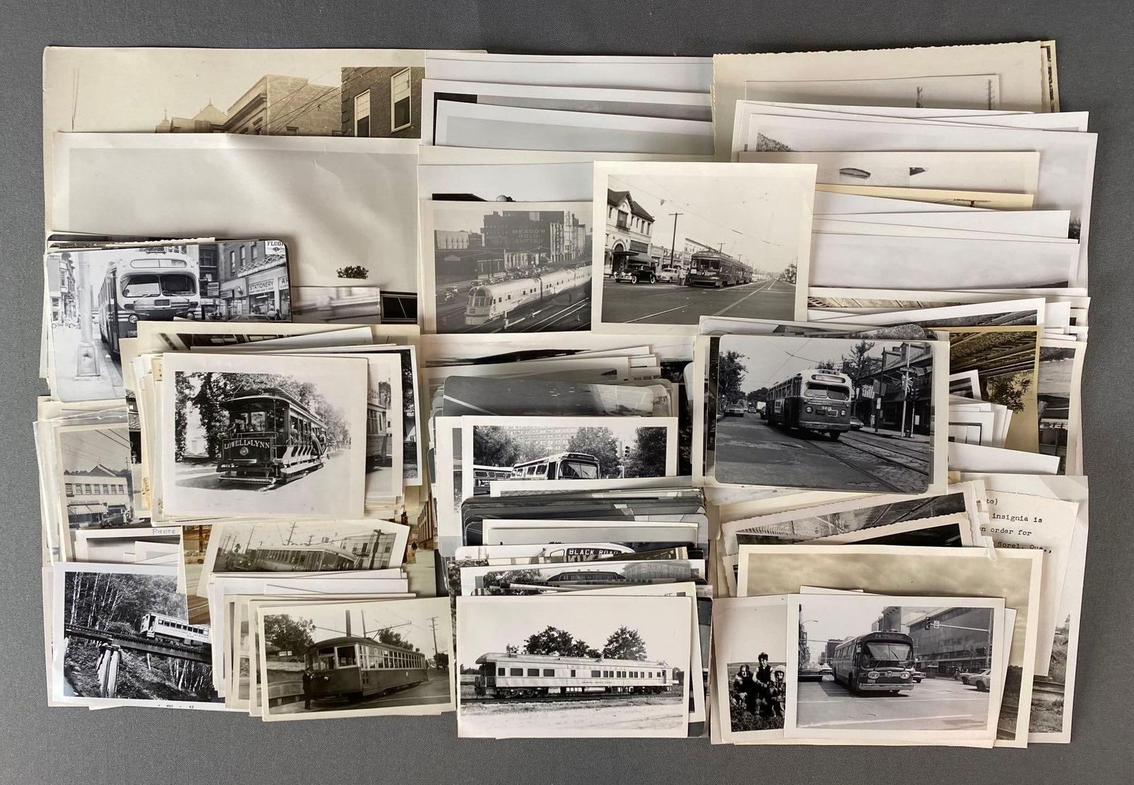 Group of Railroad Photographs and More: 120+ photos, includes engines, train cars, people, and more, majority black and white, largest measures 8 x 10in.