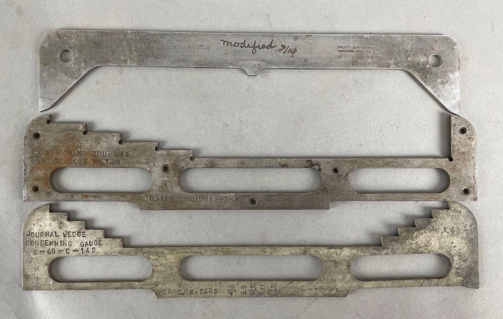 Group of 3 Railroad Gages: Journal wedge condemning gages, Pratt and Whitney gage. Largest measures 13 x 2 1/2 inches