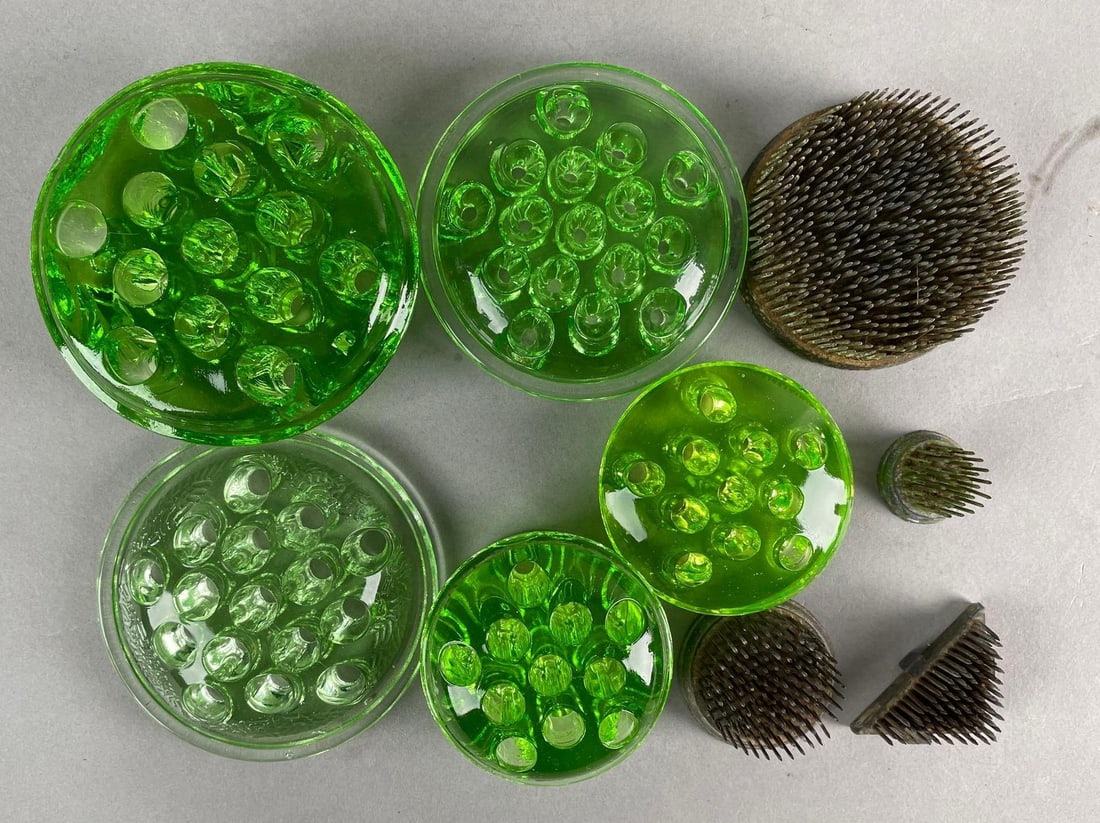 Group of 9 Vintage Uranium Glass Flower Frogs: Includes 4 metal pin flower frogs. Largest measures 4 1/2 x 1 3/4 inches