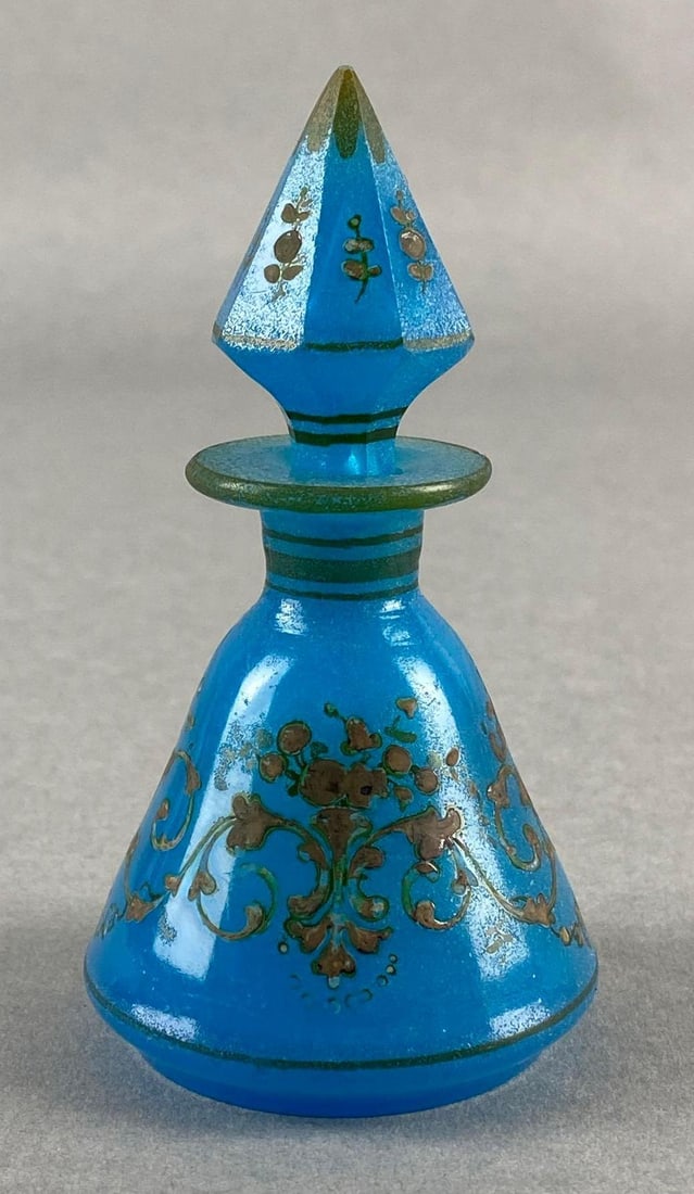 Antique Robins Egg Blue Glass Perfume Bottle: With matching stopper, Gold gilt painted florals, Measures 4 1/4 x 2 1/4 x 2 1/4 inches.