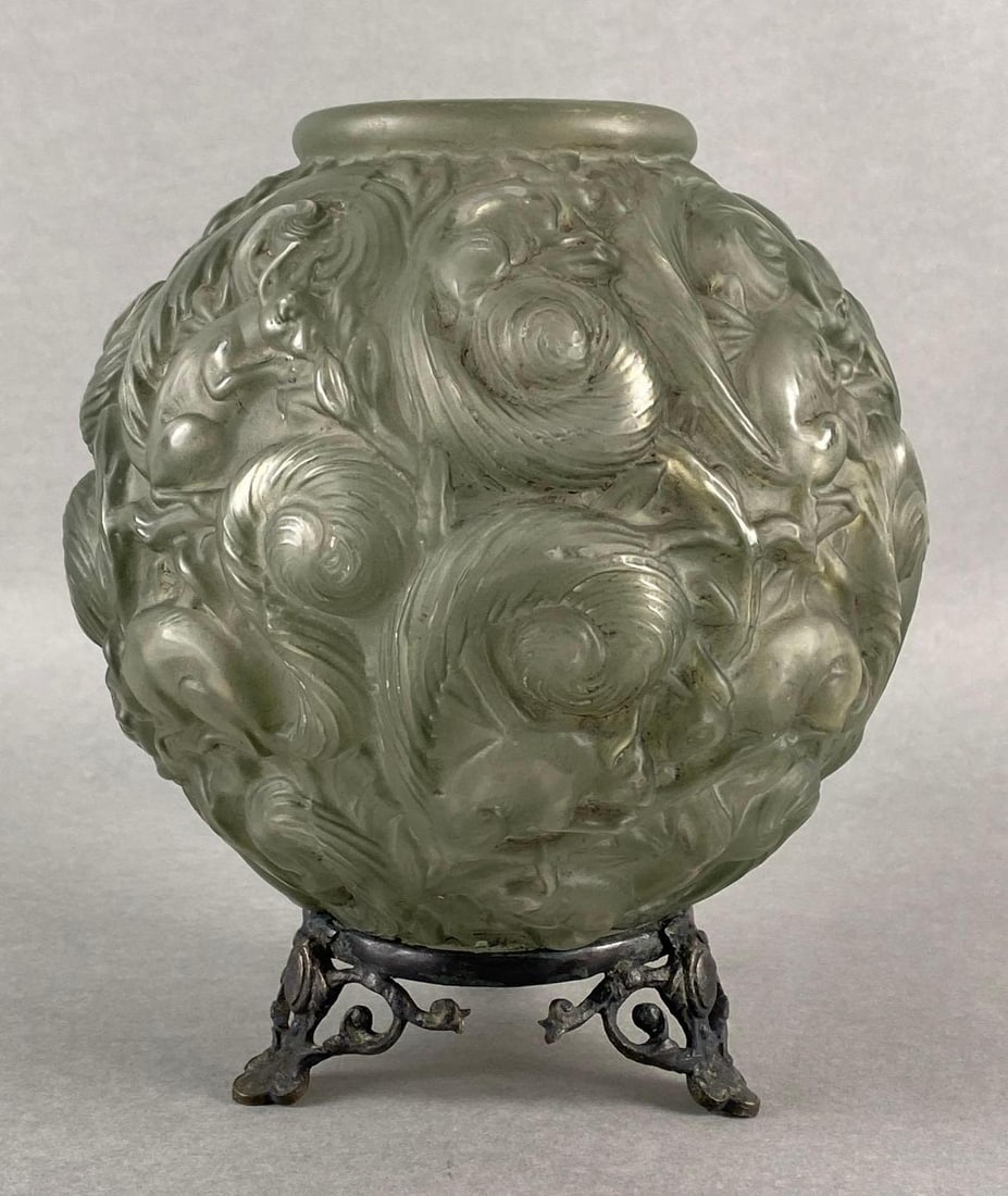 Georges Dumoulin Squirrel Patterned Molded Glass Vase: Unsigned, With attached metal pedestal feet, Needs cleaning, Measures 8 x 7 x 7 inches.