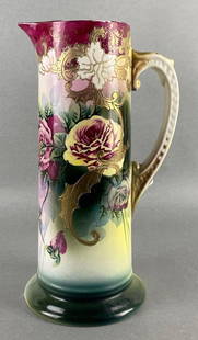 Royal Nippon Nishiki Hand-Painted Porcelain Floral Tankard Pitcher: Makers mark on base, Handmade 36163, No. 183/539, With gold gilt enamel accents, Long crack along top edge, Smaller cracks and chips near base, Measures 13 x 6 x 7 1/4 inches.