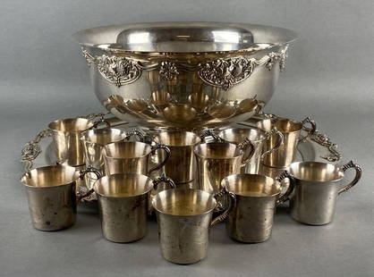 Wallace Silversmiths Silverplate Punchbowl Serving Set: Includes (1) punchbowl, (1) serving tray, and (12) mugs, Some tarnishing, Punchbowl measures 7 3/4 x 15 1/4 x 15 1/4 inches, Serving tray measures 20 x 20 x 1 inches.