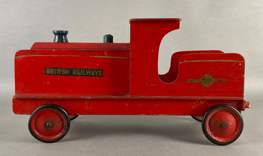 Vintage Leeway Pull Along British Railways Wooden Train Locomotive: Made in England, Some paint chipping, Measures 9 3/4 x 18 1/2 x 6 1/2 inches.