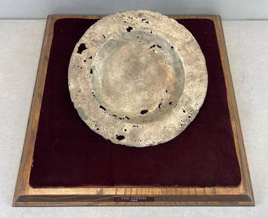 Silver Plate Recovered from the Spanish Atocha Shipwreck: With COA, Nuestra Senora De Atocha sank in 1622, Ingot recovered in 1985 by Treasure Salvors, With display case base but no top. Plate measures 9 1/4 inches round. Total weight 255.7 grams