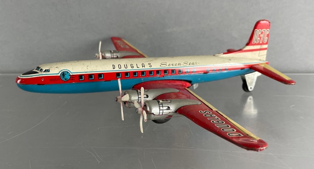 Vintage Douglas Seven Seas DC-7C Friction Tin Litho Airplane (1 of 5)