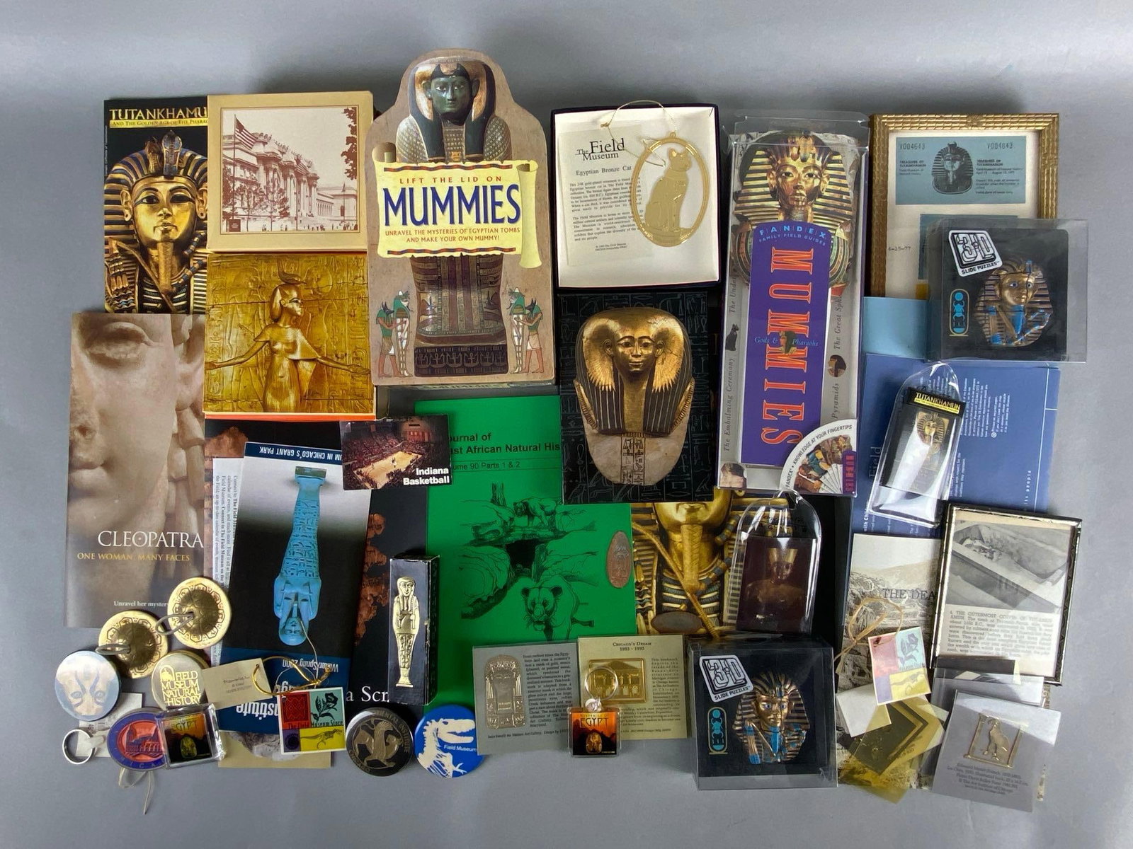 Group of 20+ Assorted Field Museum of Natural History Souvenirs and Brochures: Includes Egypt, Eastern Asian, East African, and more, Largest measures 11 x 7 1/2 inches.