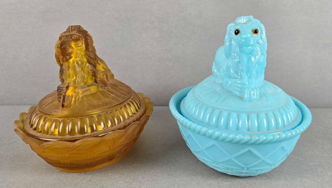 Group of 2 Vintage Seated Lion Covered Glass Candy Dishes: Blue milk glass lion made by Westmoreland, measures 6 1/4 x 7 1/2 x 6 inches