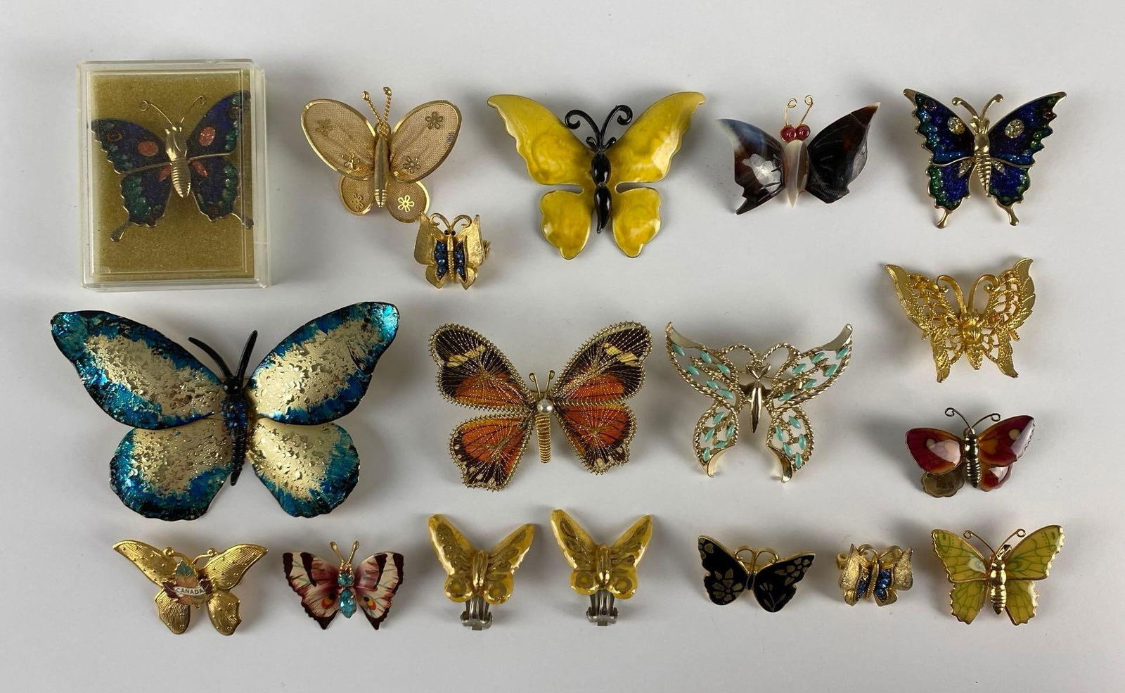 Group of 17 Costume Jewelry Butterfly Broaches and Earrings: Largest measures 2 1/4 x 3 1/2 inches.