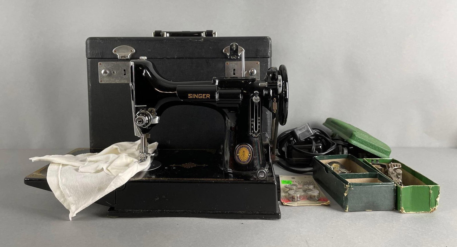 1951 Singer Portable Featherweight Sewing Machine with Case: Includes pedal, bobbins, accessories. Untested, 100th anniversary. Case missing one hasp, measures 11 1/2 x 14 1/2 x 8 1/2 inches