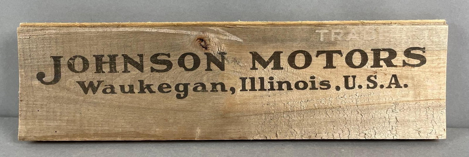 Vintage Johnson Motors Wood Advertising Sign: Waukegan, Illinois. Measures 5 1/2 x 18 1/2 inches