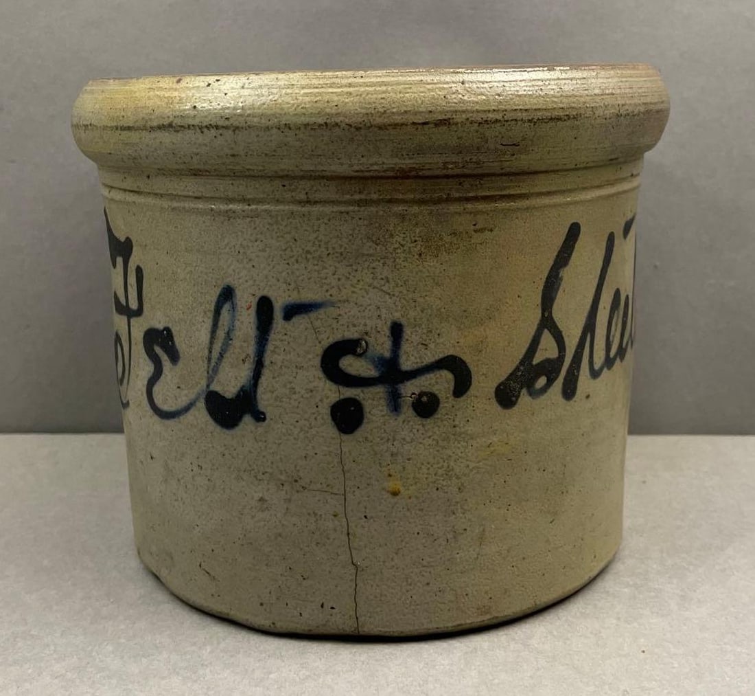1/2 Gallon Felt and Steele Salt Glaze Stoneware Crock: Cobalt lettering, crack at bottom. Measures 5 3/4 x 7 inches