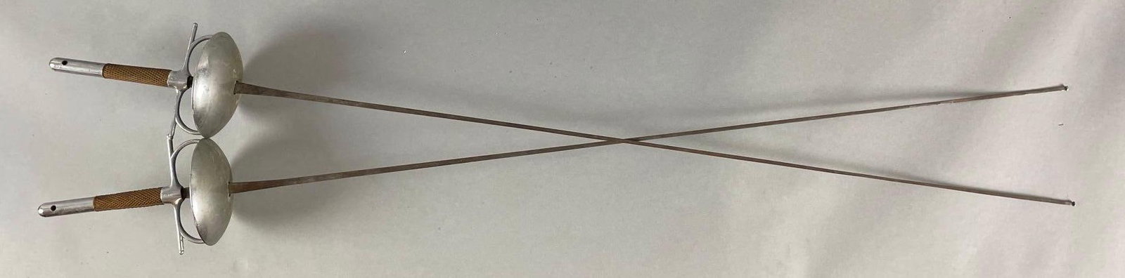 Pair of Vintage Castello Fencing Foils: Each measure 42 inches with a 4 1/8 inch bell