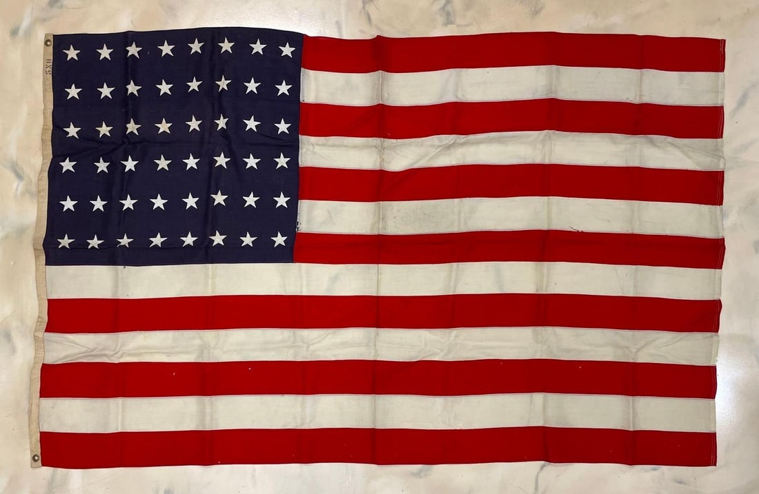 48 Star U.S. Flag: 5 x 8 feet. Some small holes and repairs