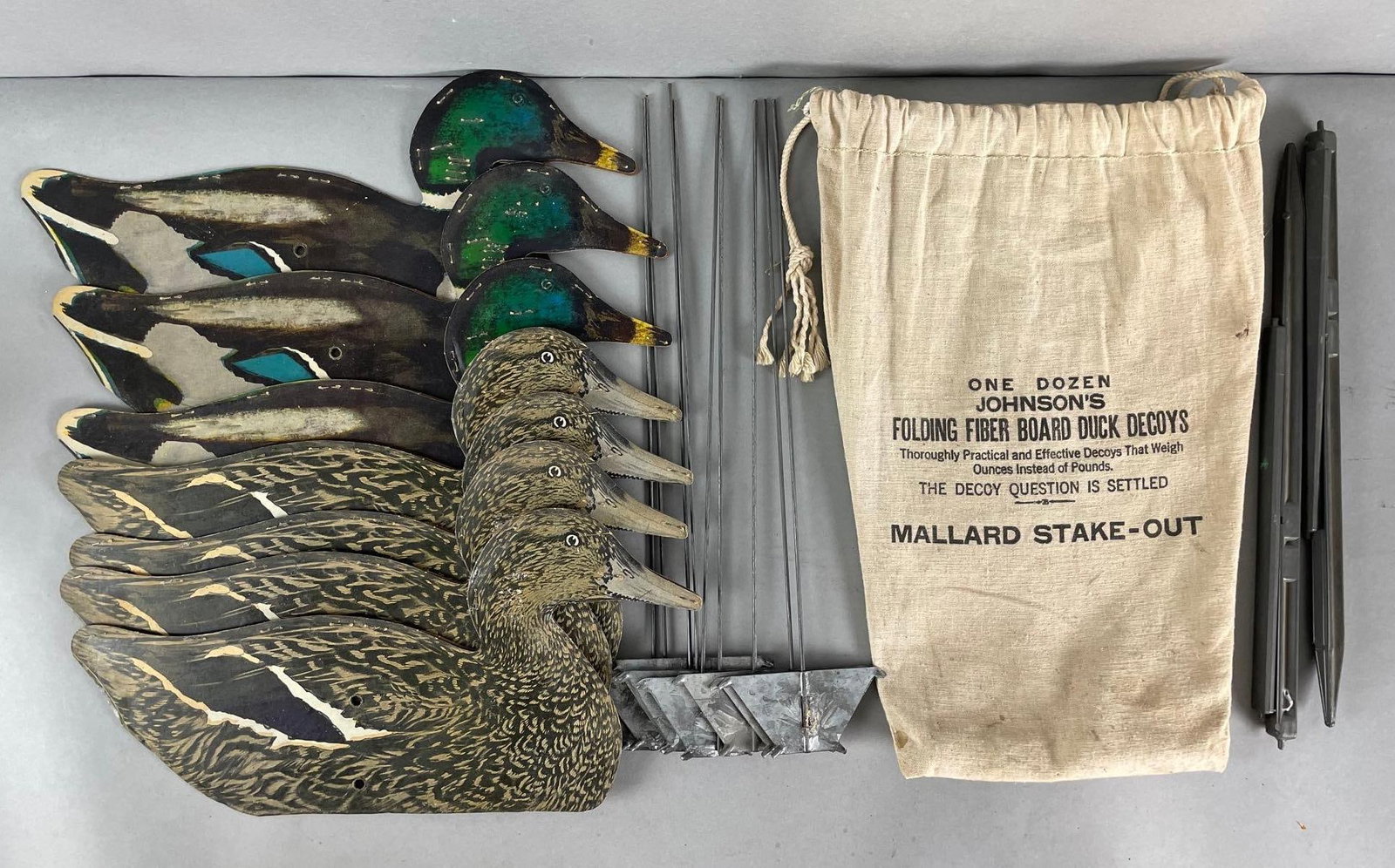 Group of 7 Vintage Johnsons Folding Fiberboard Duck Decoys and Stakes: Includes stakes, original bag. Decoys measure 7 3/4 x 16 inches flat