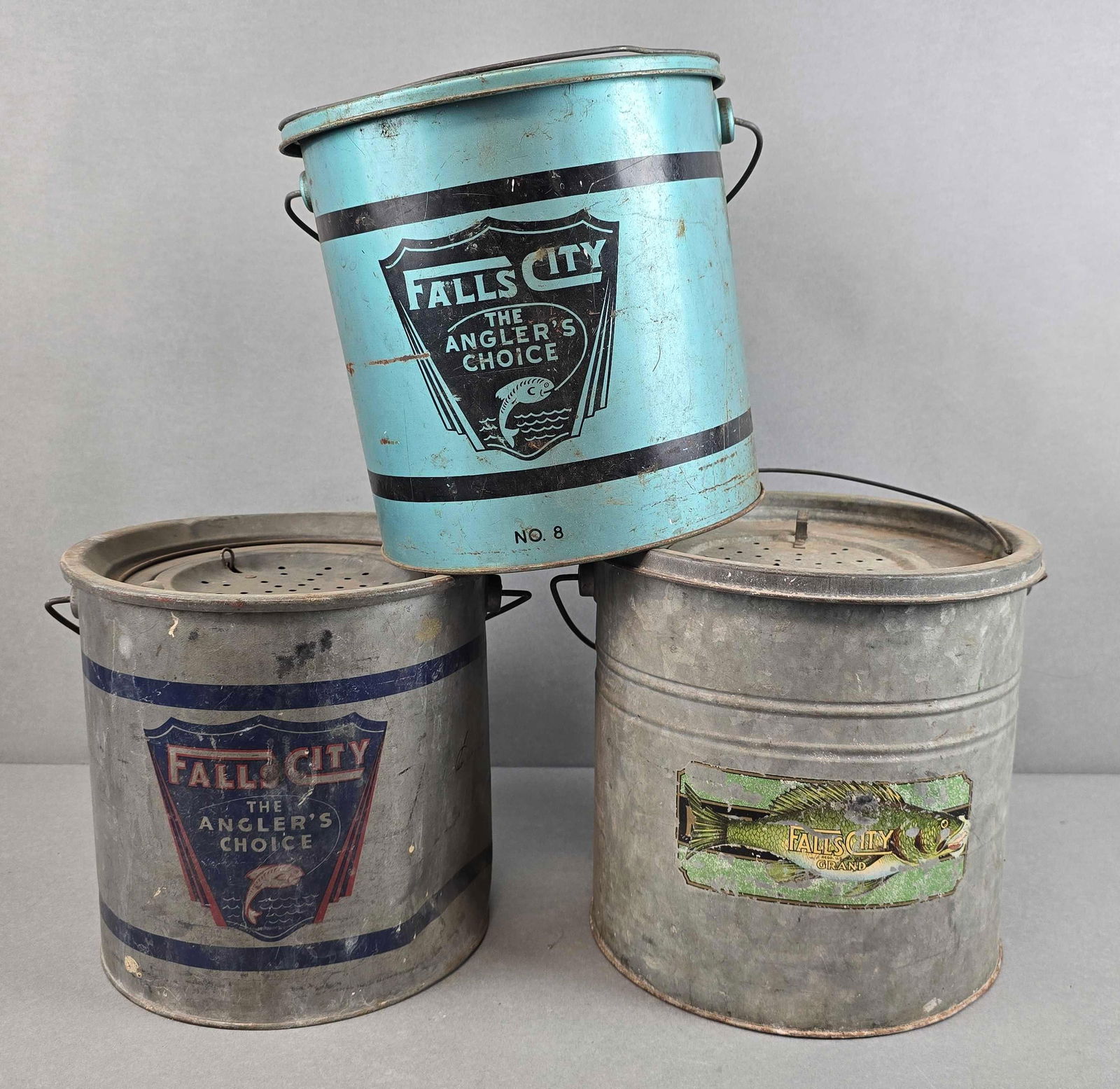 Group of 3 Falls City Metal Minnow Buckets: Scratches and rusting throughout, blue bucket measures 9 x 10 1\2 x 9 1/2 inches