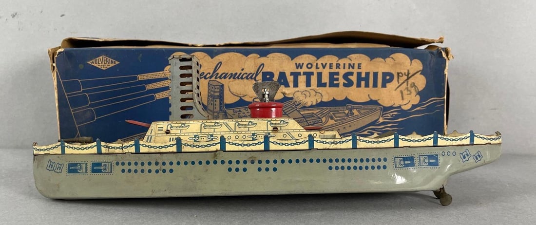 Vintage Wolverine Tin Litho Wind-Up Mechanical Battleship: Working condition, needs a little help sometimes to get started. Includes original box. Measures 4 1/2 x 14 1/4 x 3 inches