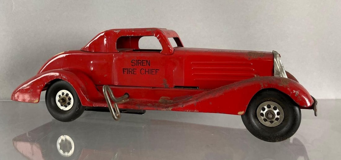 Vintage Marx Siren Fire Chief Tin Litho Wind-Up Car: Working condition. Measures 4 1/2 x 14 1/4 x 5 1/4 inches