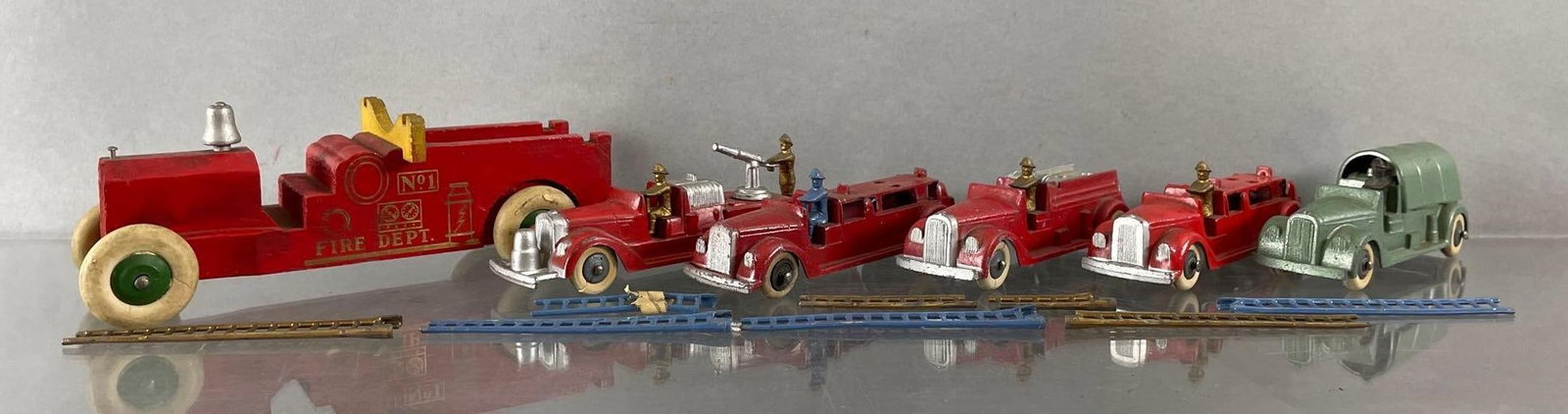 Group of 6 Tootsietoy Die-Cast Firetrucks: Includes ladders, and wood fire truck. Diecast vehicles measure 4 1/2 inches long