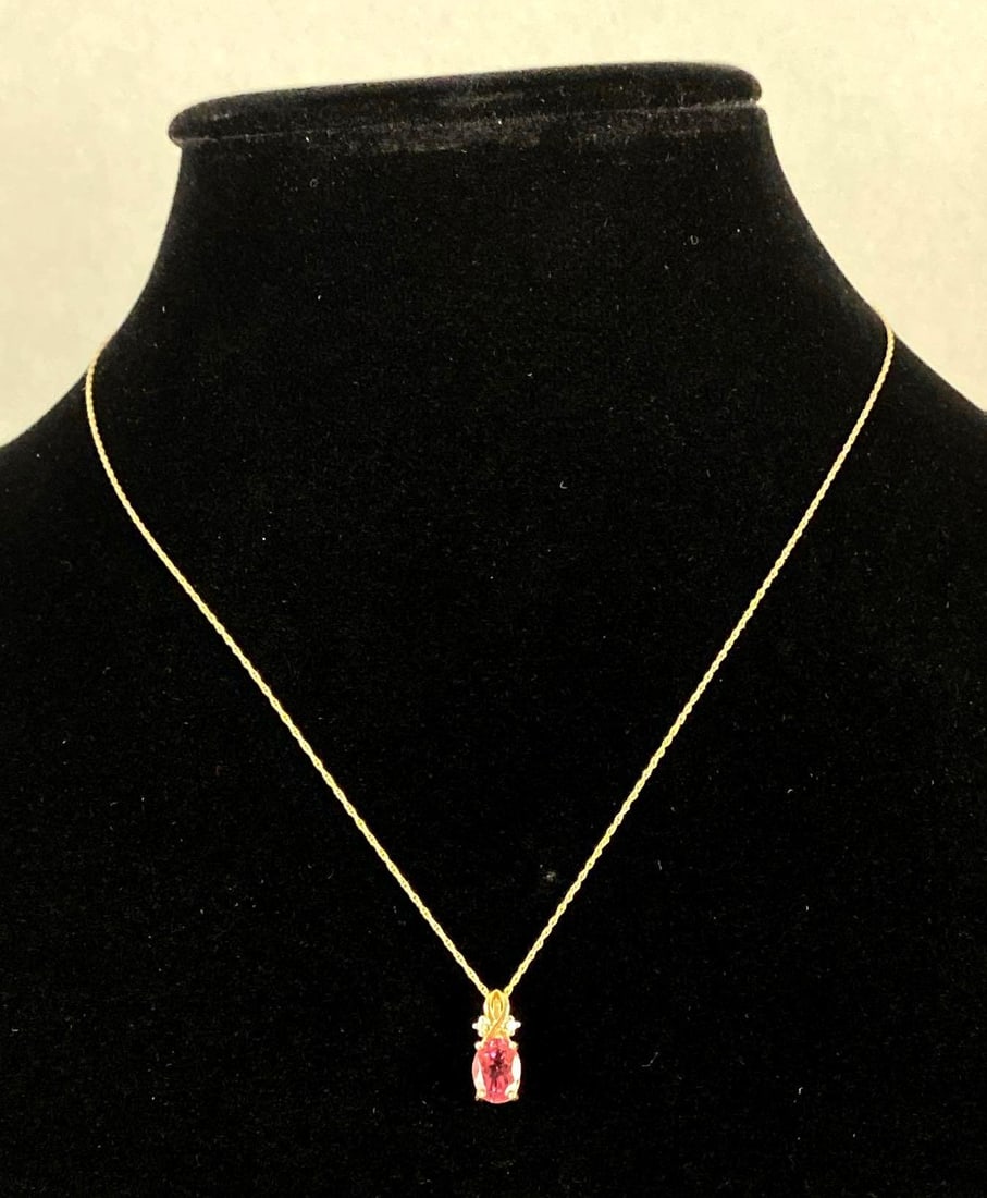 14K Gold Garnet and Diamond Pendant Necklace: Total weight 1.8g, 14K gold pendant, 10K gold chain, Chain measures 18 inches long.