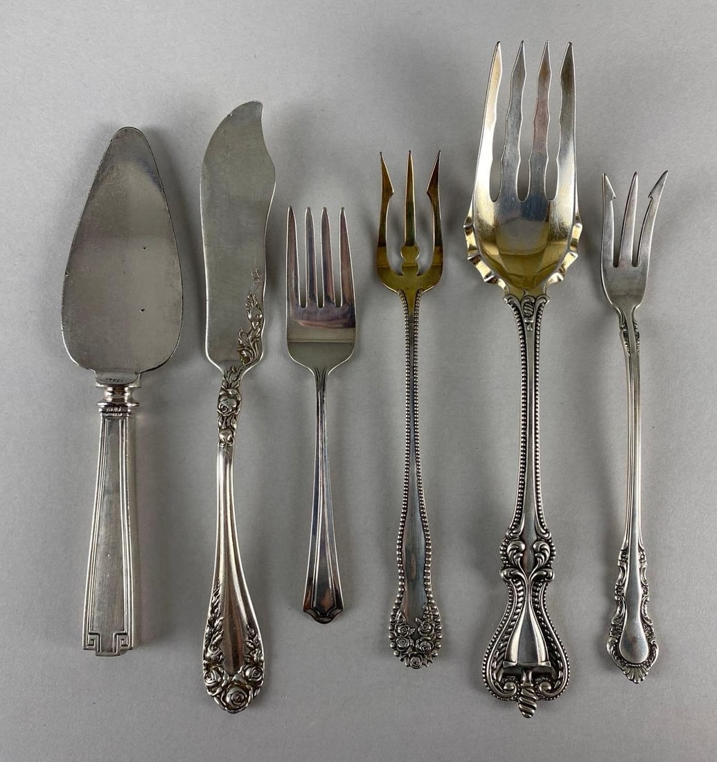 Group of 6 Sterling Silver Serving Utensils: Total weight 172.9g, Includes Reed Barton Pickle Fork, O.D. Peacock Pickle Fork, Baby fork, Tea Cake server, and more, Longest measures 7 1/4 inches long.