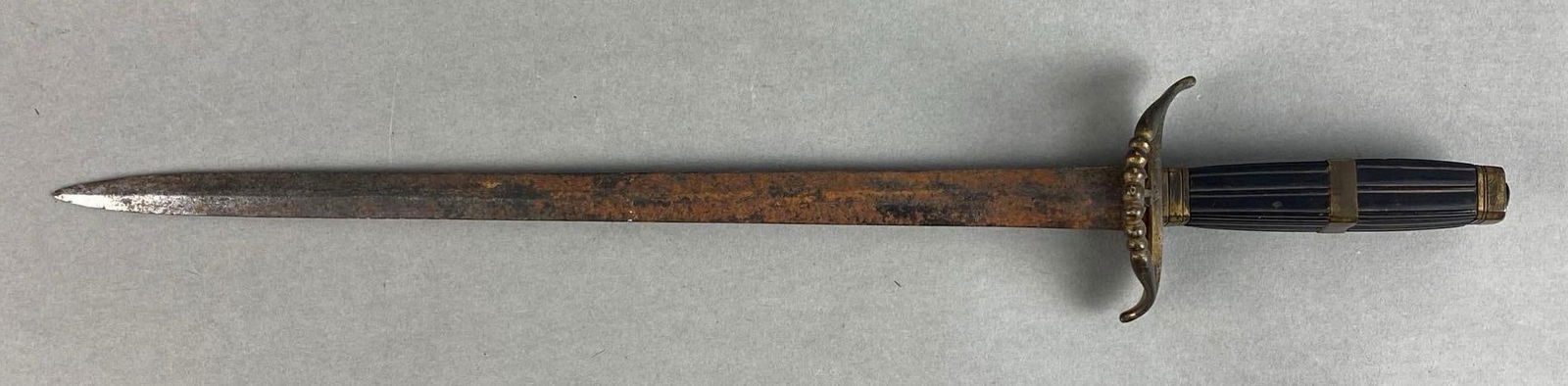 Double-Sided Maritime Dagger: Rusting throughout, anchor adorned on guard and handle, blade length measures 13 1/2 inches, overall length measures 18 inches