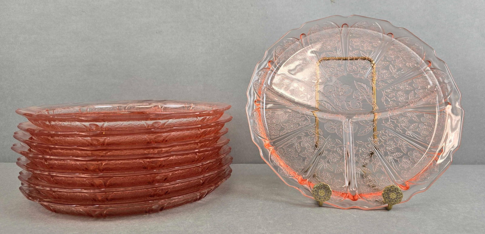 Group of 8 Pink Depression Glass Cherry Blossum Platea: Each measures 9 1/4 x 9 1/4 inches