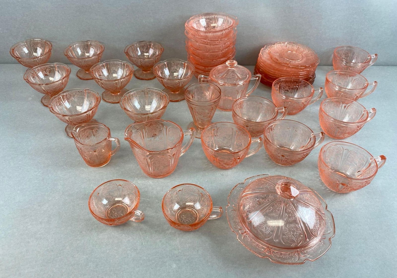 Group of 40+ Pink Cherry Blossom Depression Glass: includes tea cups, sherbets, plates and more, largest measures 4 1/4 x 6 x 6 inches