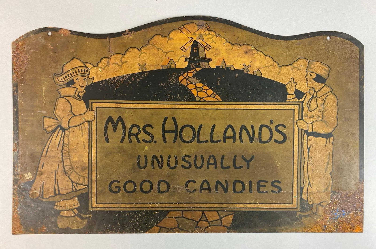 Vintage Mrs. Holland’s Unusually Good Candies Painted Double Sided Metal Advertising Sign: paint chipping and cracking throughout, measures 14 3/4 x 24 inches