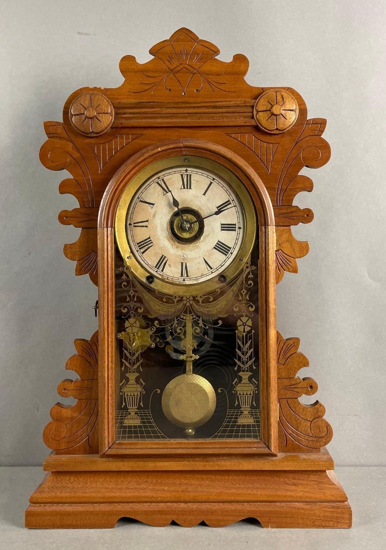 Wood Gingerbread Mantle Clock: Working condition, does not include winding key. Measures 21 1/2 x 13 3/4 x 4 1/2 inches