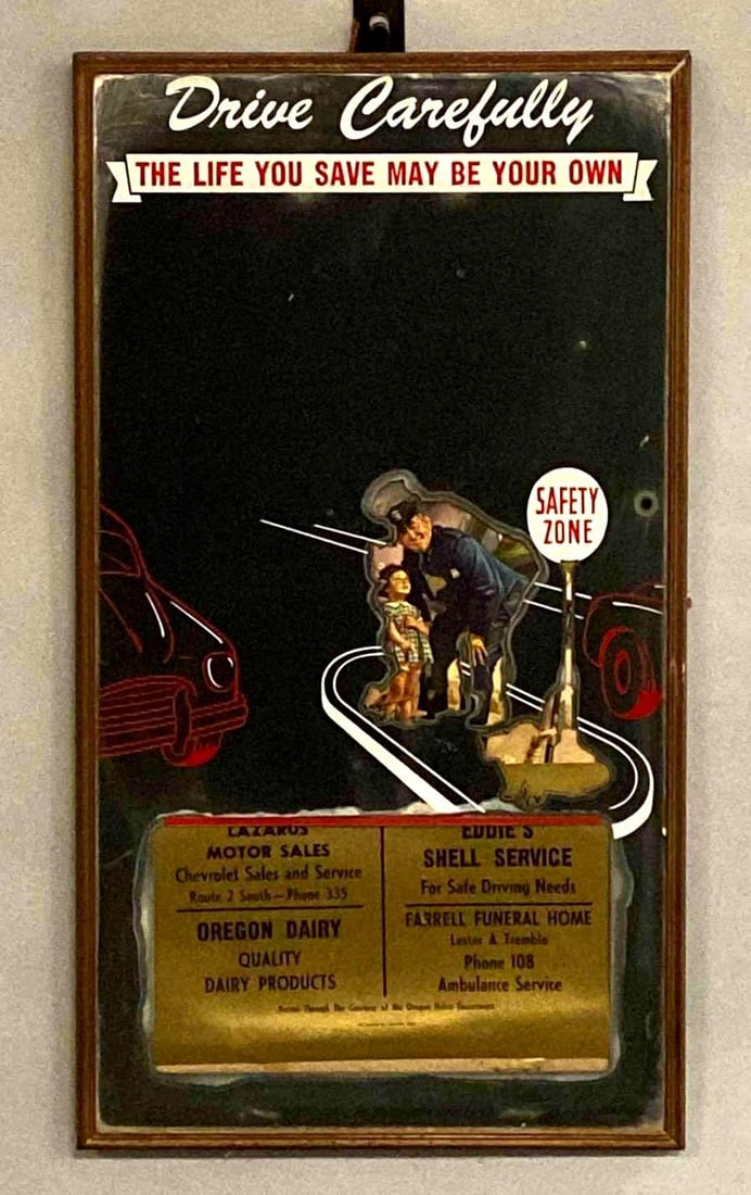 Drive Carefully Oregon Advertising Mirror: Includes advertisements for Lazarus Motor Sales, Eddies Shell Service, Oregon Dairy, and Farrell Funeral Home, Measures 22 x 12 inches.