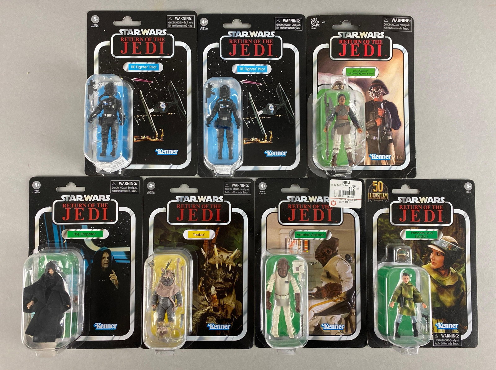 Group of 7 Kenner Star Wars Return of the Jedi Figures: Includes Teebo, The Emperor, Admiral Ackbar, new in original packaging, each measures 9 x 6 inches