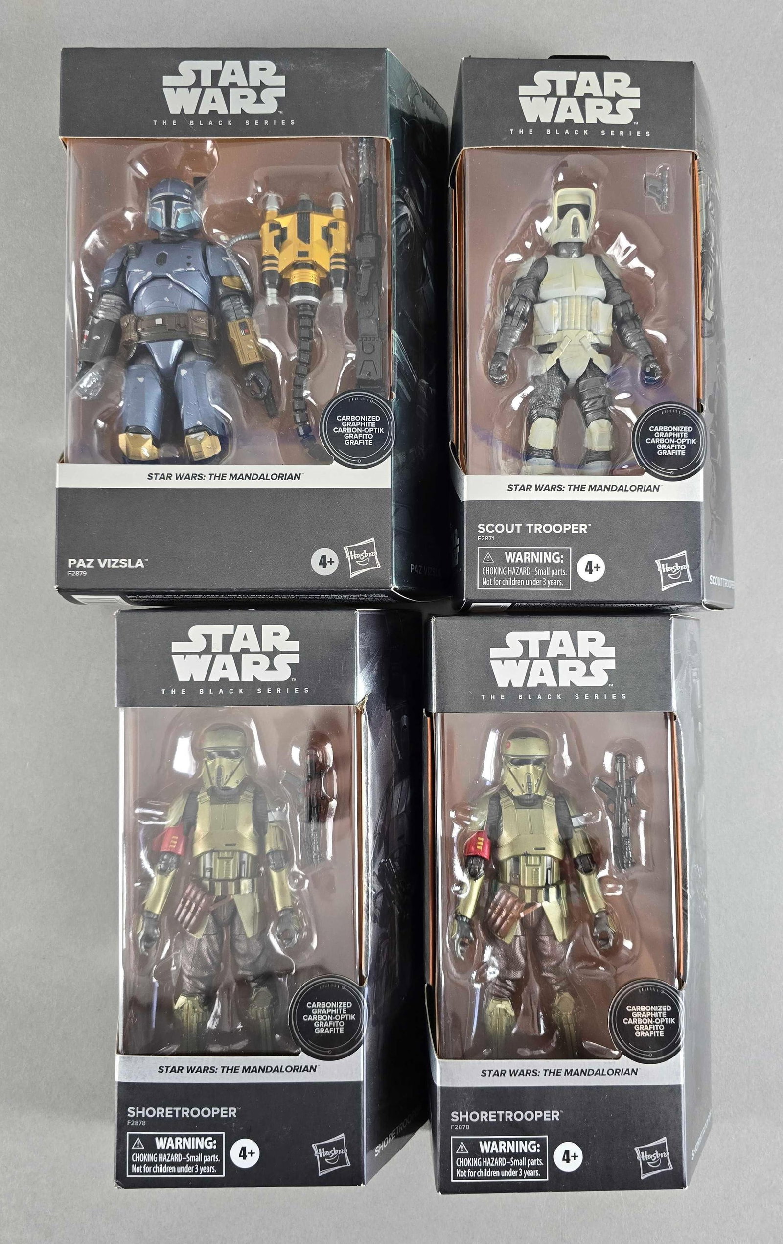 Group of 4 Hasbro Star Wars The Mandalorian Figures: Includes scout trooper, shoretrooper and Paz vizsla, new in original packaging, largest measures 9 x 6 1/2 x 2 inches