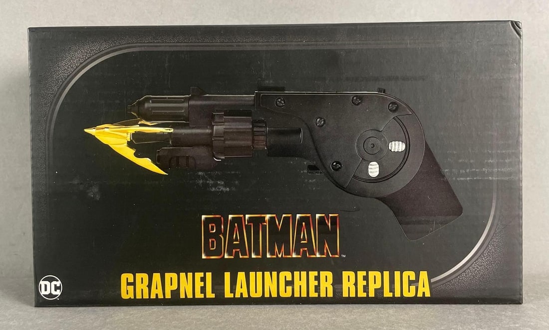 Neca Batman Grapnel Launcher Replica: Sealed original packaging measures 5 x 8 3/4 x 2 1/4 inches