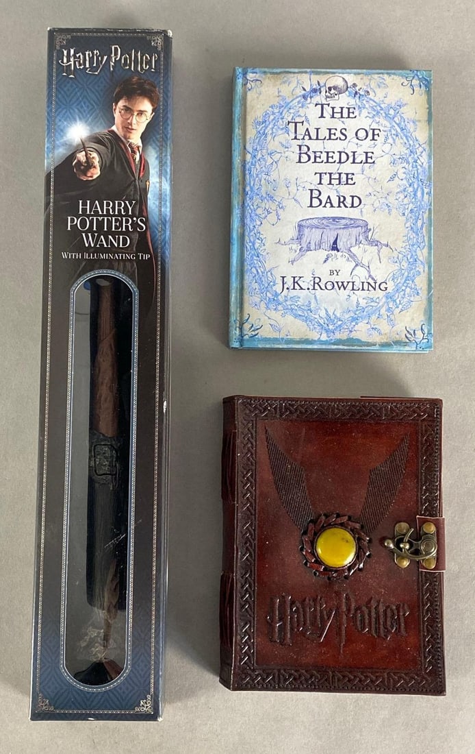 Group of 3 Harry Potter Items: Includes Harry Potters Wand with Illuminating Tip, The Tales of Beedle and Bard, and Golden Snitch Journal, Untested, Largest measures 16 1/2 x 3 x 1 3/4 inches.