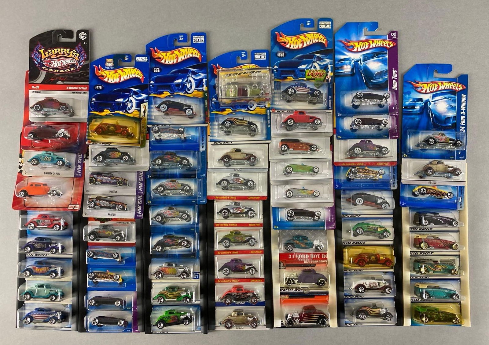 Group of 60+ Mattel Hot Wheels Die-Cast Ford Cars: majority are 1933 Fords, new in original packaging