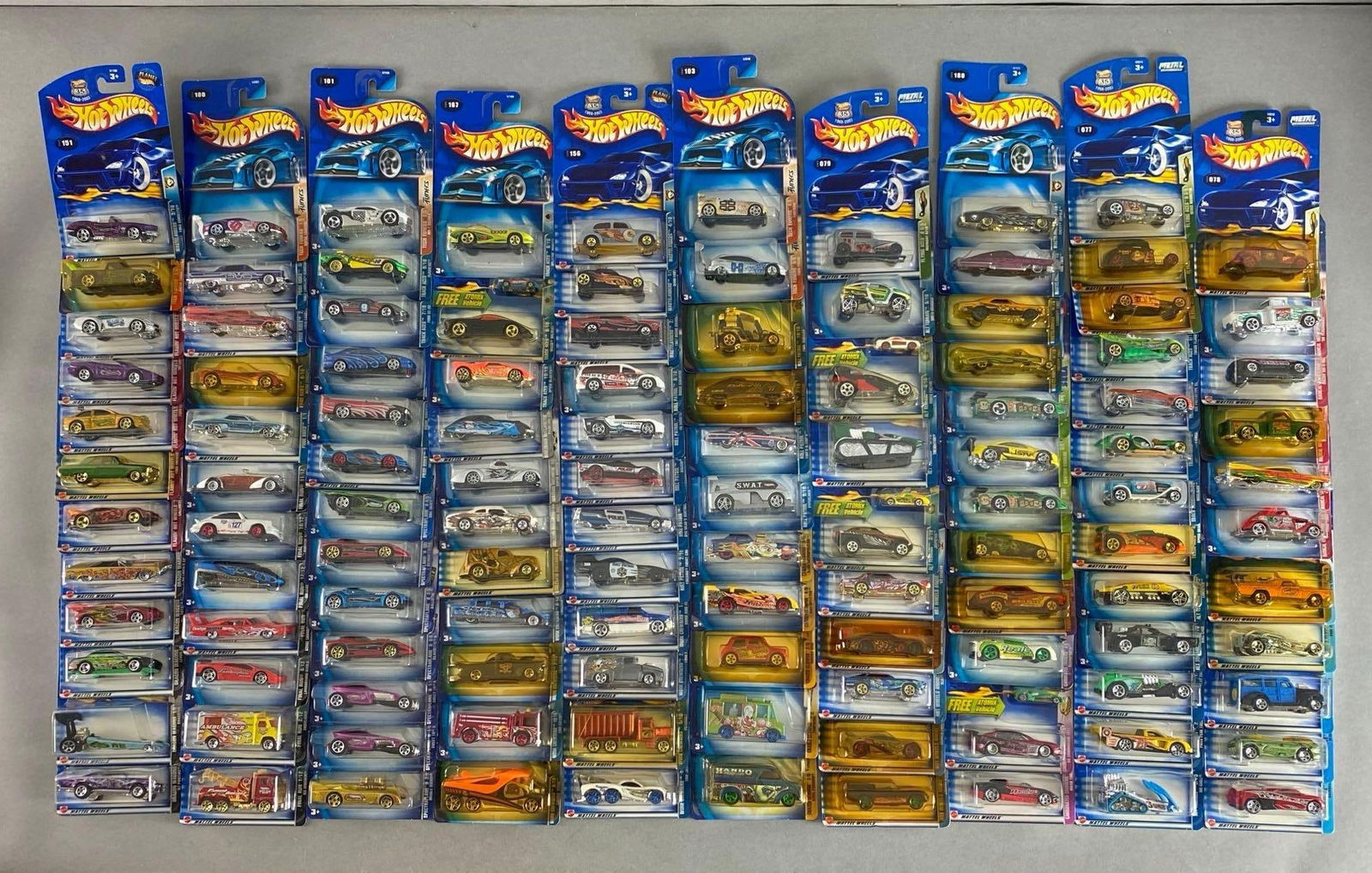 Group of 110+ Mattel Hot Wheels Die-Cast Cars: Includes wild wave series, radical wrestlers, flying aces and more, new in original packaging