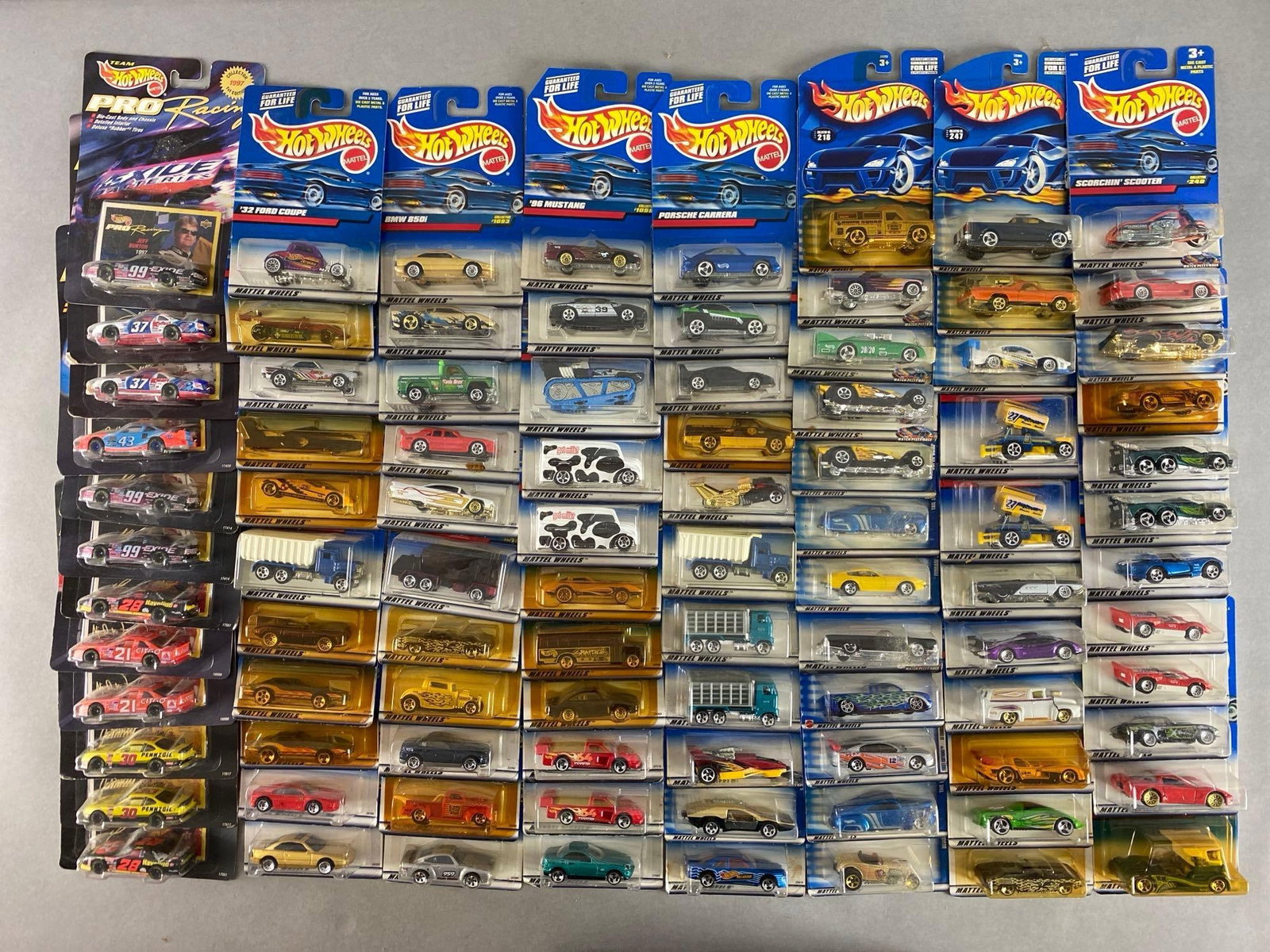 Group of 170+ Mattel Hot Wheels Die-Cast Vehicles: Includes nascar, Porsche Carrera, 1996 mustang and more, like new in original packaging