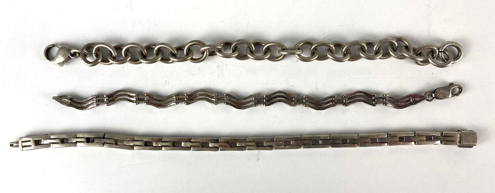 Group of 3 Sterling Silver Link Bracelets: Total weight 70.9g, Longest measures 7 3/4 inches long.