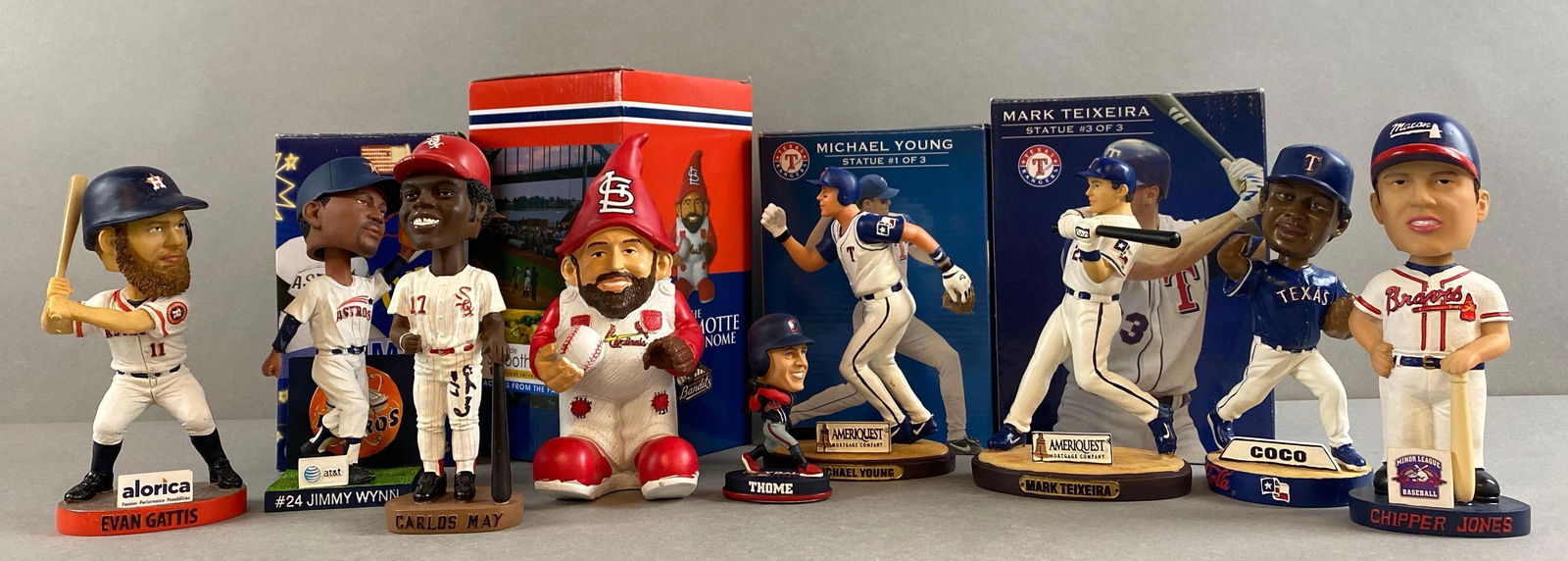 9 - Baseball Bobbleheads with Chipper Jones and Signed Carlos Mays: Alorica Evan Gattis, 2010 45th anniversary Jimmy Wynn, Autographed Carlos Mays #17, Bayside Smoothies and More Jason Motte Garden Gnome, 2 - 2005 Ameriquest Michael Young, Mark Teixeira, 2005 BD and A