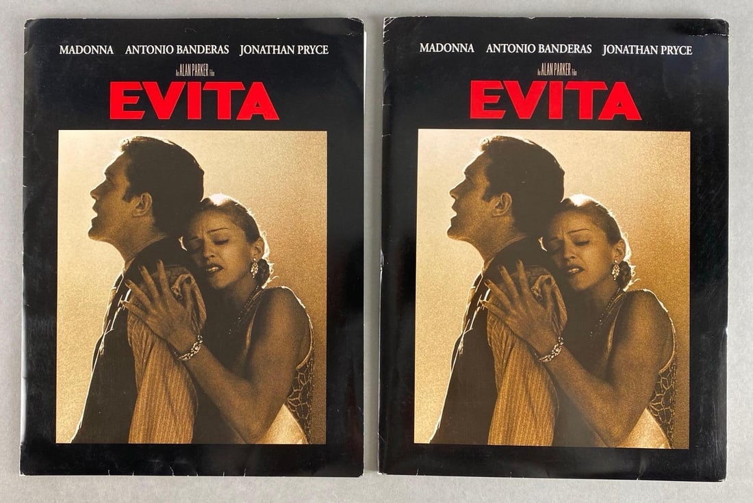 Group of 2 1966 Evita Press Kits: Director: Alan Parker, Starring Madonnna, Antonio Banderas, and Jonathan Pryce, Kits include stills, press papers, and slides, Both measure 12 x 9 inches.